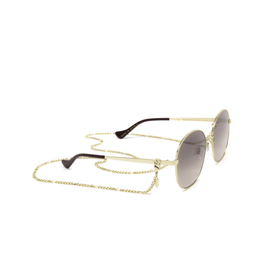 Gafas de sol Gucci GG1090SA 002 gold - Vista tres cuartos