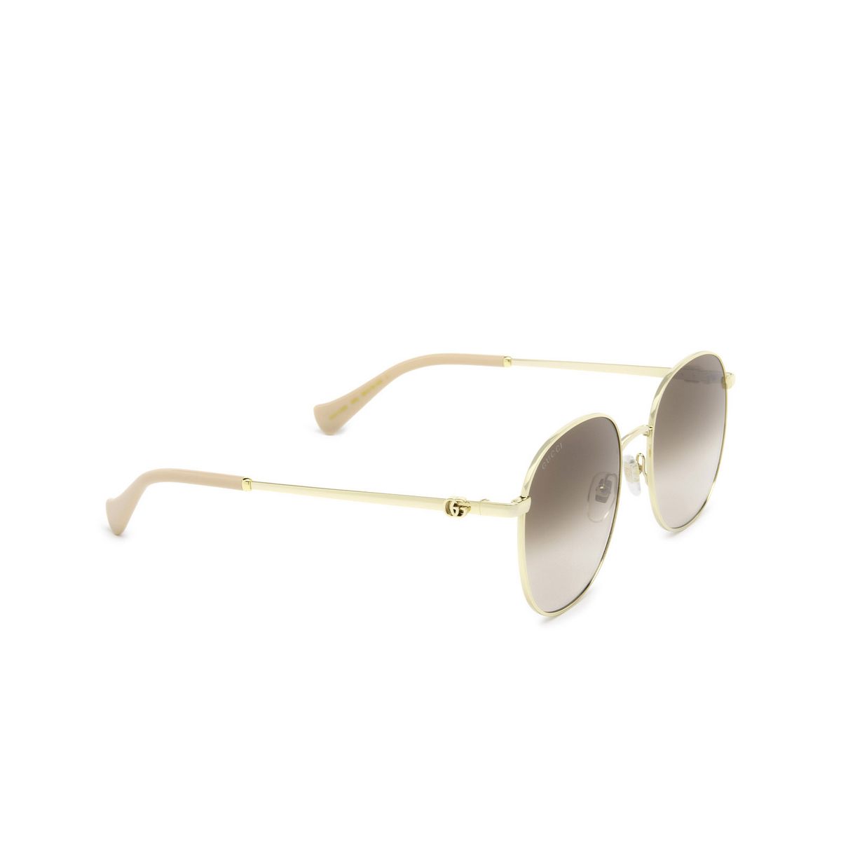 Gucci® Round Sunglasses: GG1142S color Gold 002 - three-quarters view.