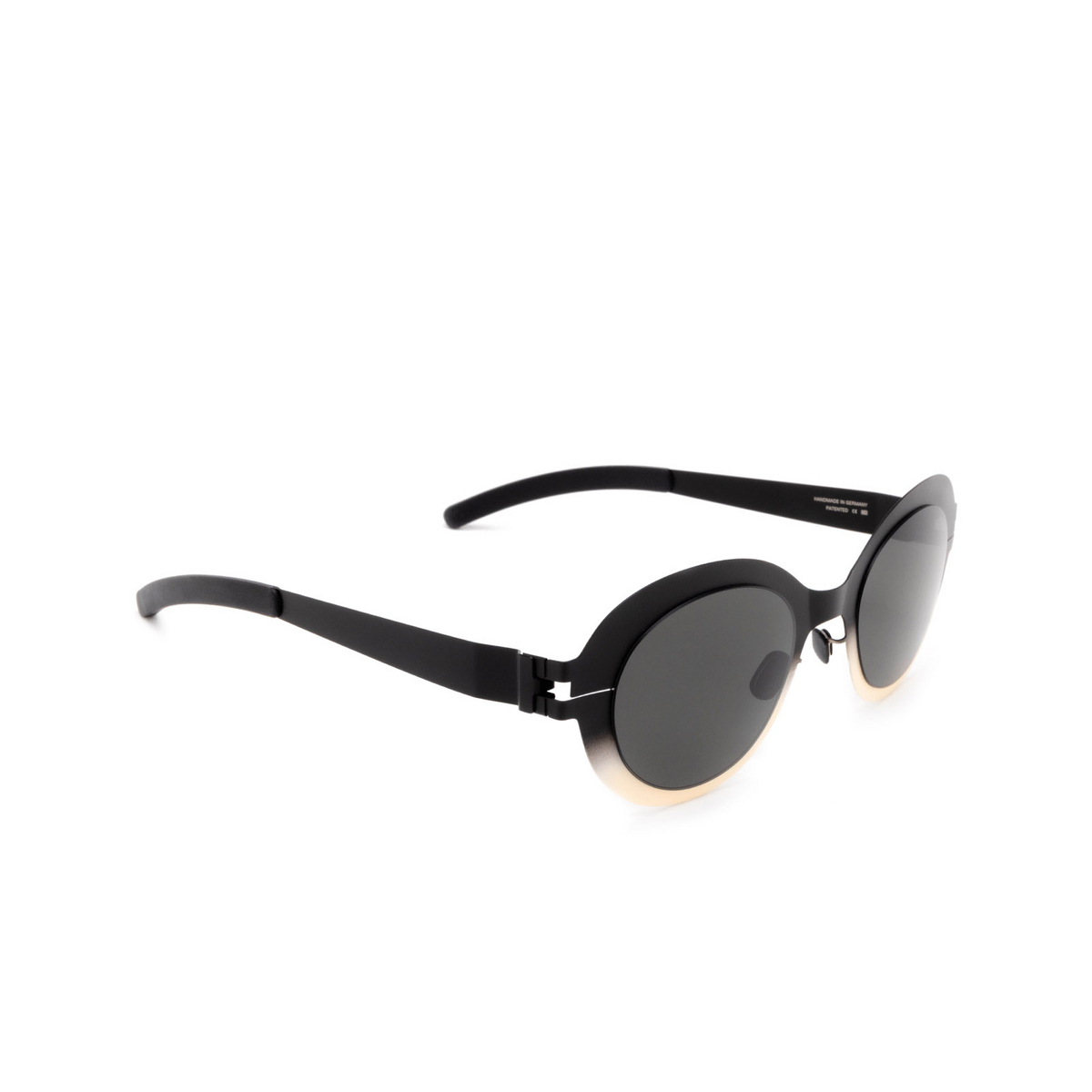 Mykita® Oval Sunglasses: Focus color 476 Black/chantilly White - three-quarters view