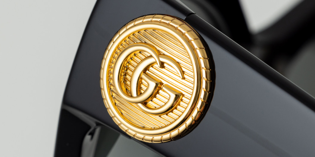Gucci Sonnenbrille mit Button-Logo