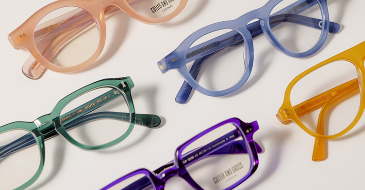 Different color eyeglasses on white background