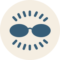 Icon of sunglasses blocking sun rays