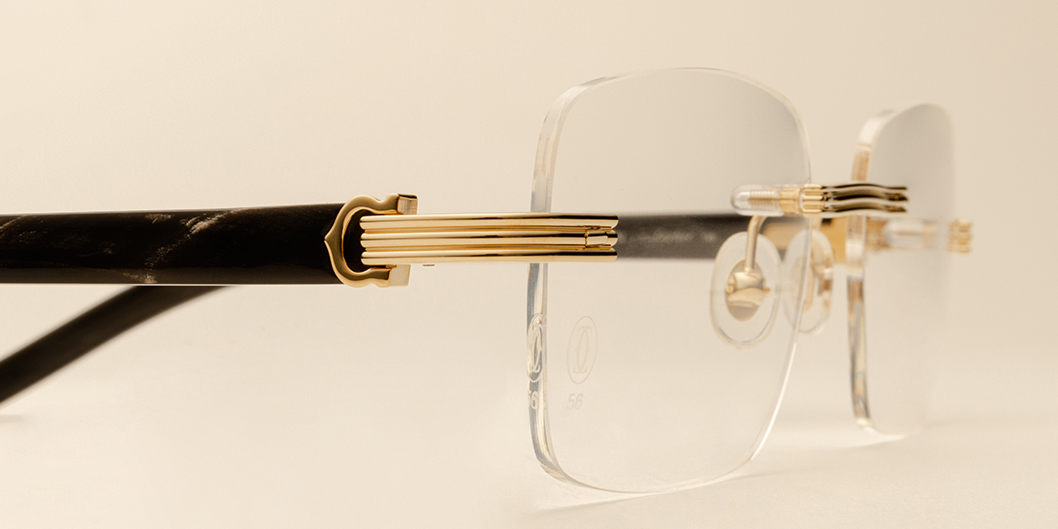 Investment pieces: Cartier gold rimless eyeglasses with C décor 