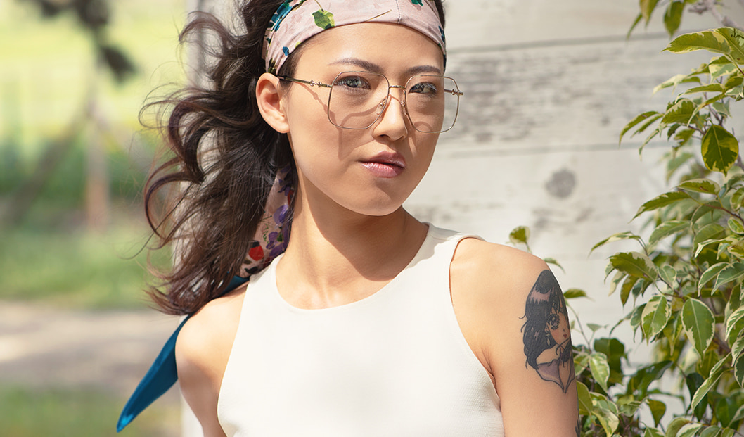 Young woman wearing 70s-inspired Gucci eyeglasses